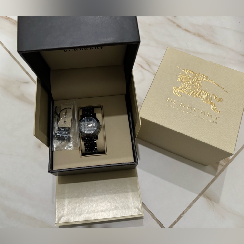 Sleek black metal women’s Burberry watch